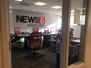 The news room that the anchors, writing staff, and producers gather in to pitch stories and ideas and determine who reports on what issue and when.